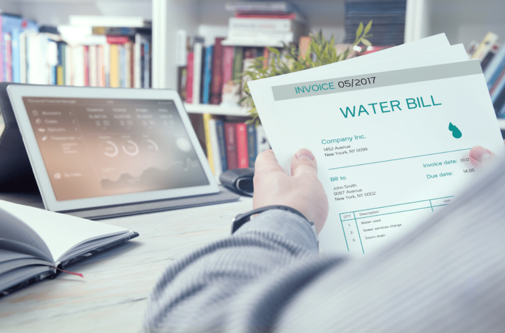 Homeowner reviewing a high water bill